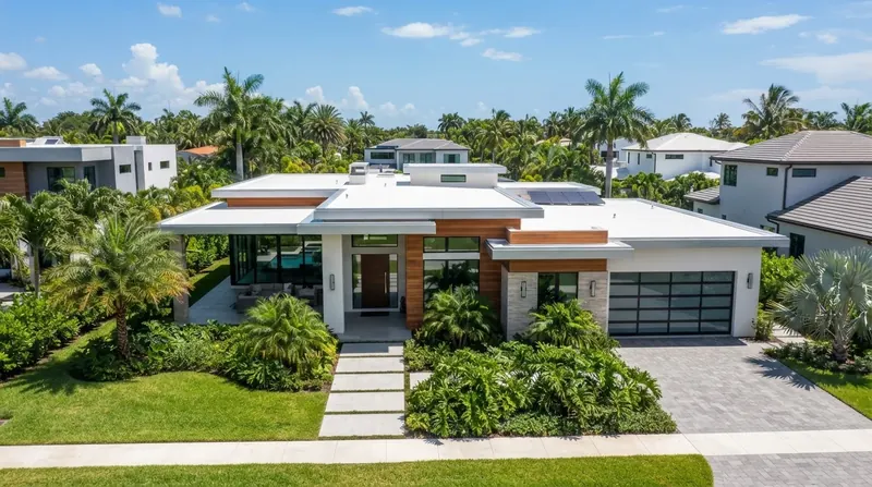 Contemporary single-story home with a white low-slope flat roof